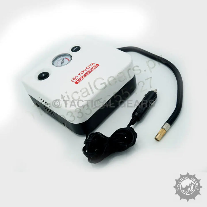 White and black Toyota air compressor with pressure gauge and 12V car adapter