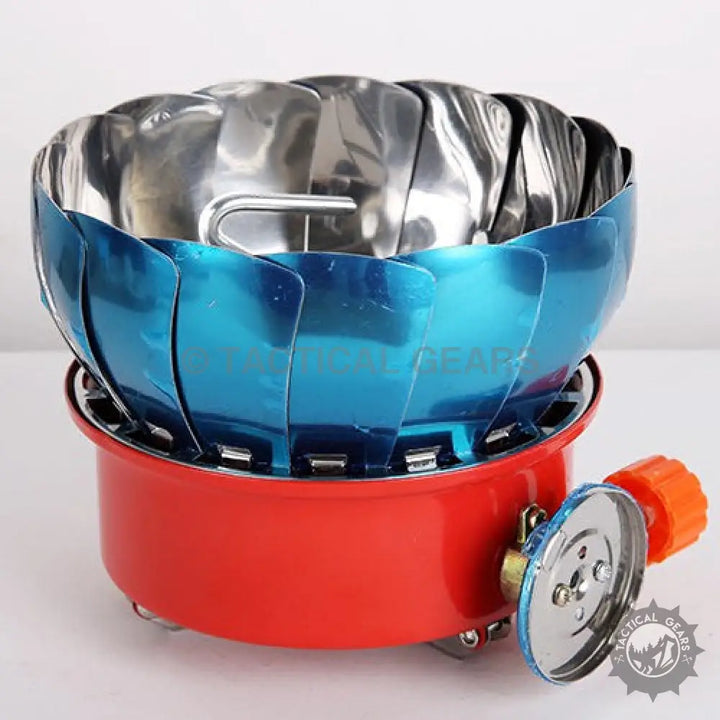 Red and blue portable camping gas stove with windproof design for outdoor cooking