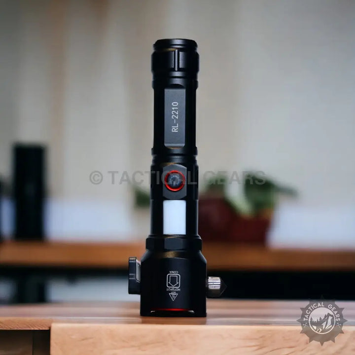 Black tactical flashlight with side controls and white light panel for powerful tactical torch with 1KM range