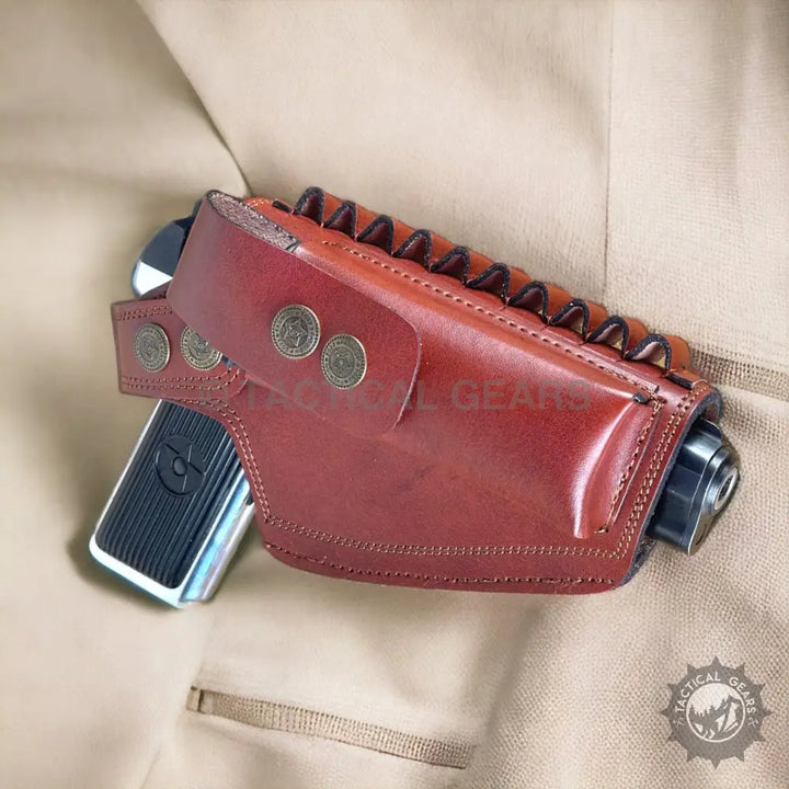 Brown leather 9mm holster with decorative snaps and ammunition loops for carrying