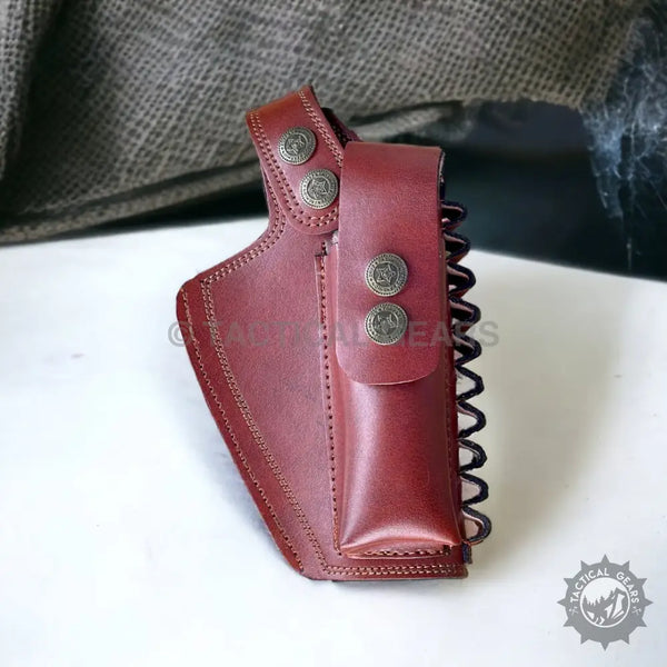 Reddish-brown leather 9mm holster with snap closure and attached pouch for carrying