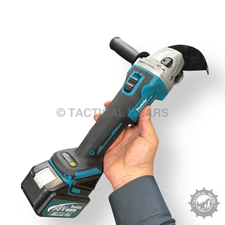 Rechargeable angle grinder with teal and black body, side handle, and safety guard