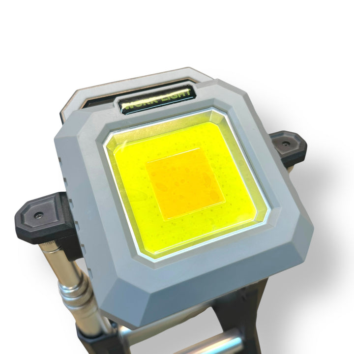 Gray portable LED folding work light with bright yellow illumination and 9000mAh power bank