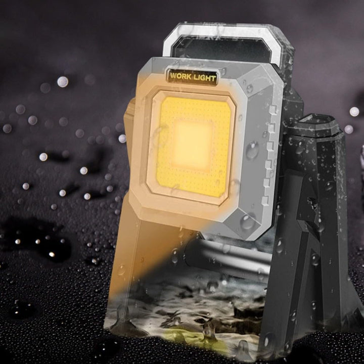 Water-resistant portable folding work light with bright yellow LED and multifunctional telescopic power bank