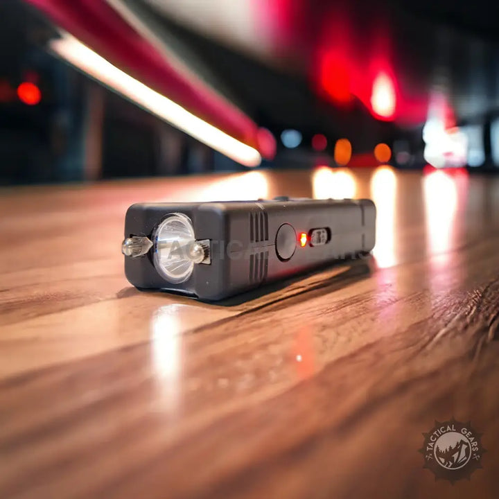 Black Tactical Pocket Taser with flashlight and red indicator light for self-defense