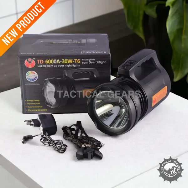 Rechargeable LED searchlight with handle and charging accessories for long-range illumination