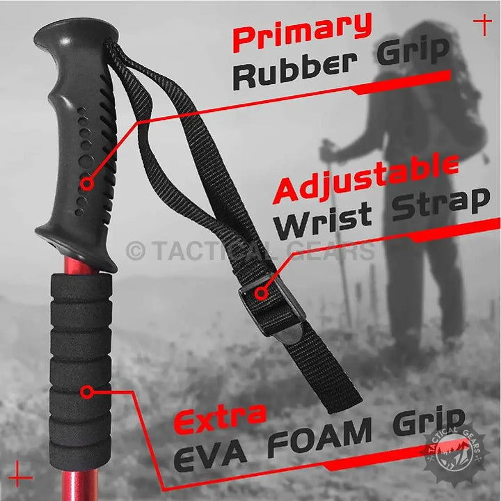 Red and black antishock hiking stick with rubber grip and foam strap