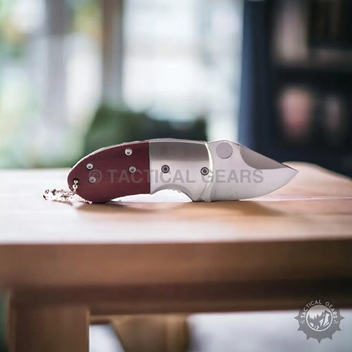 Browning Mini Knife: red and silver folding pocket knife with short wide blade