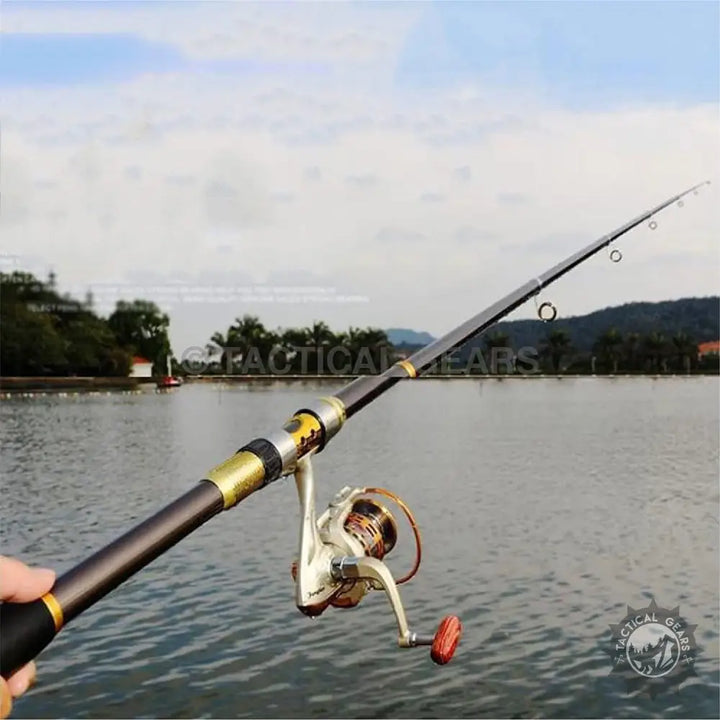 Retractable fishing rod set with spinning reel, dark grey body, gold accents for anglers