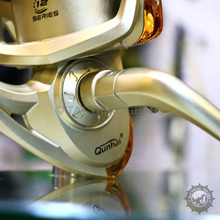 Golden fishing reel with handle from Retractable Fishing Rod Set for versatile fishing
