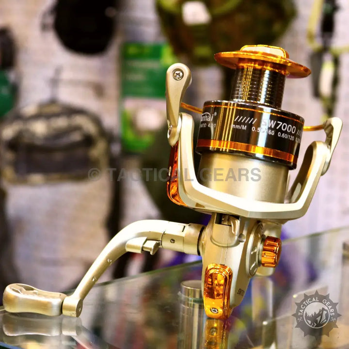 Silver and gold fishing reel with foldable handle on Retractable Fishing Rod Set