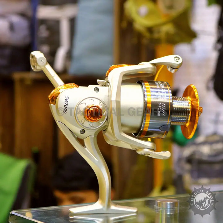 Fishing reel with gold and silver finish from Retractable Fishing Rod Set, part of a rod set
