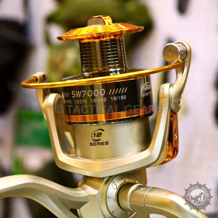 Gold and silver fishing reel with 12 Series logo on retractable fishing rod set