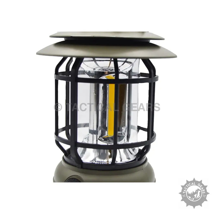 Olive green and black retro camping rechargeable solar lantern with clear glass cylinder