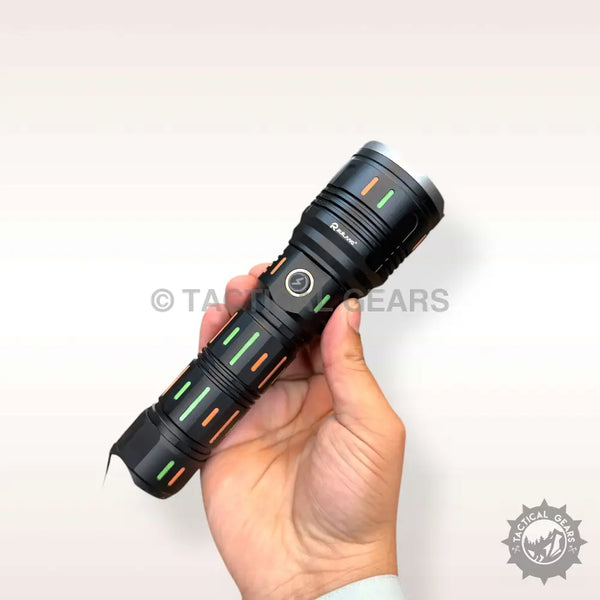 Black tactical flashlight with green and orange accents and side power button, Ruilang 1KM powerful flashlight