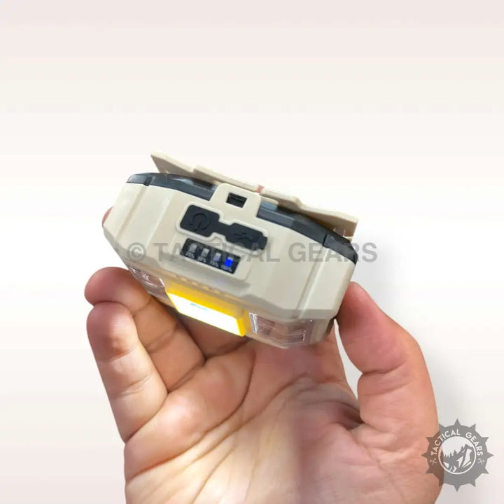 Hand-held tactical light with tan and black casing, blue indicator, part of Ruilang Bright LED Headlight series