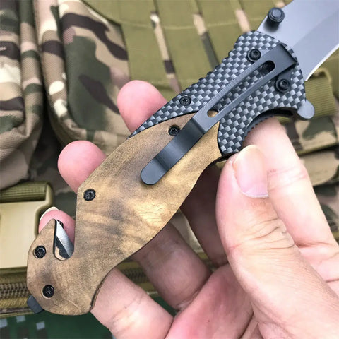 Browning X50 tactical folding knife with carbon fiber and wood handle, pocket clip, strap cutter, glass breaker