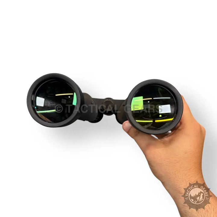 Black Sakura 90x80 zooming binoculars with green-coated lenses held in hand
