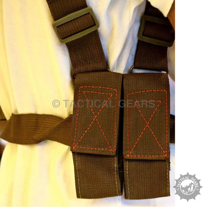 Brown tactical shoulder harness with two front pouches, ideal for shoulder holster use