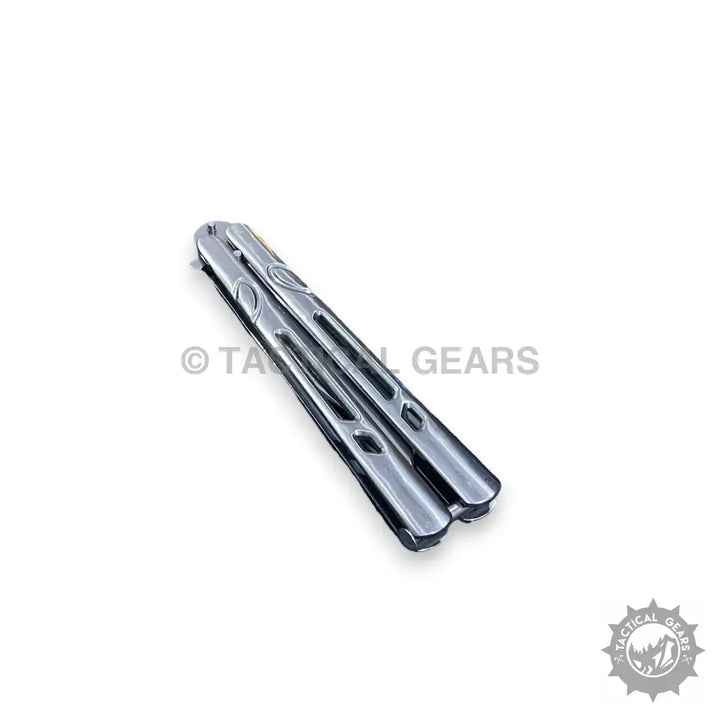 Closed silver-colored butterfly knife trainer with patterned handles, stainless steel construction