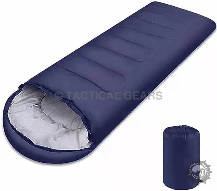 Dark blue sleeping bag with light gray interior shown unrolled and packed in compression sack