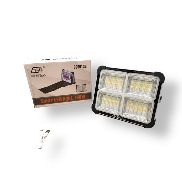 Solar 100W Flood Light with four panels and packaging for outdoor lighting efficiency