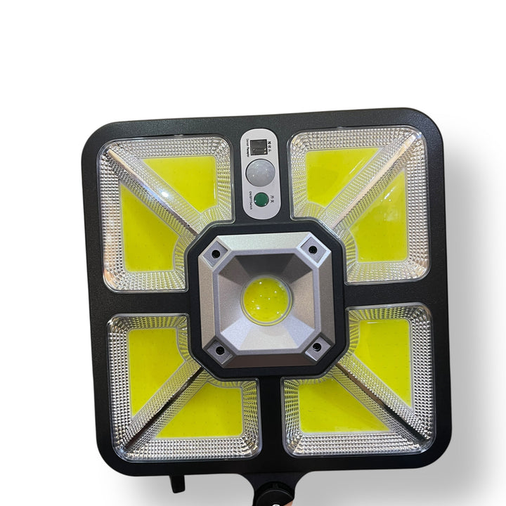 Black solar induction street lamp with LED floodlight and motion sensor for outdoor lighting
