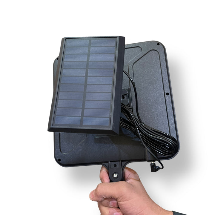 Solar Induction Street Lamp held in hand with solar panel and long connecting cable