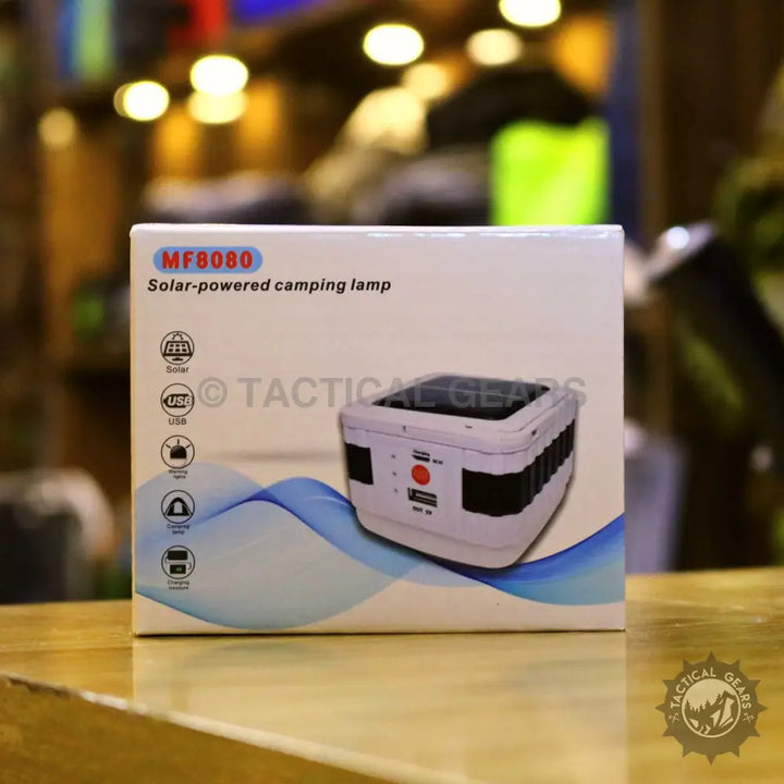 White solar powered camping lantern with USB charging for outdoor camping trips