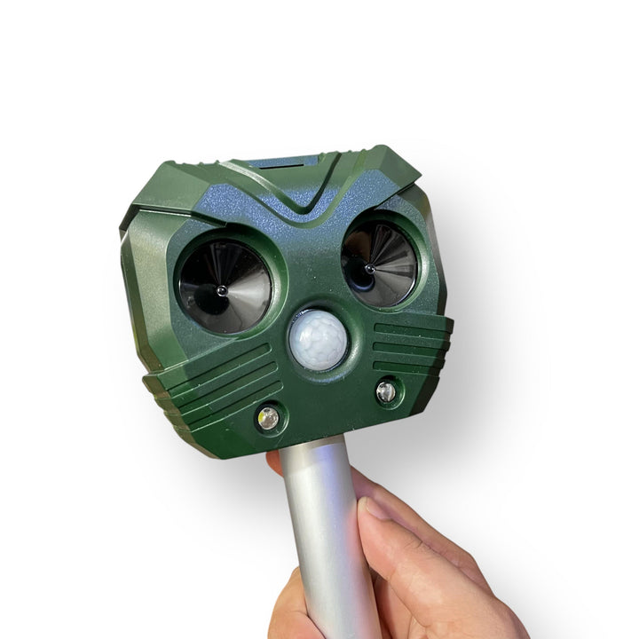 Green outdoor ultrasonic animal repellent device with motion sensor for effective animal repellent