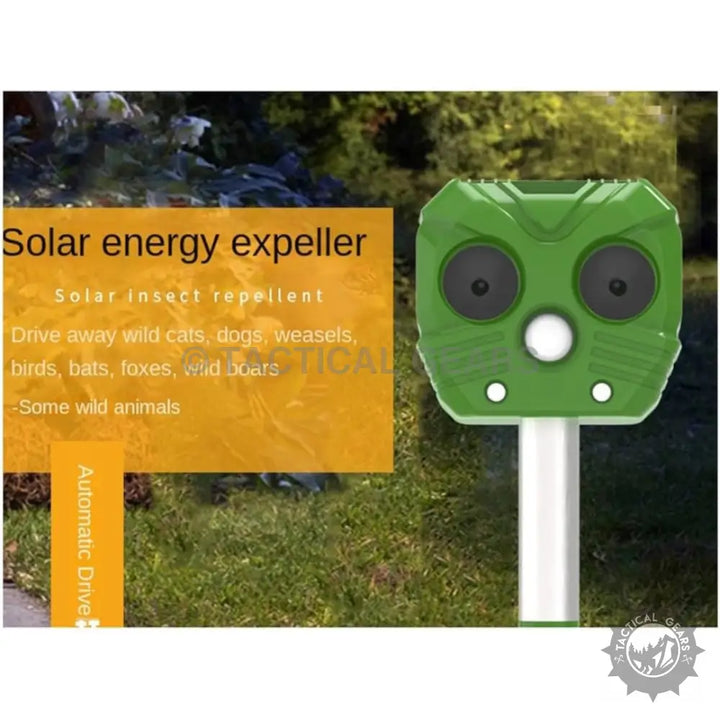 Green solar powered animal repellent with two speakers for outdoor pest control