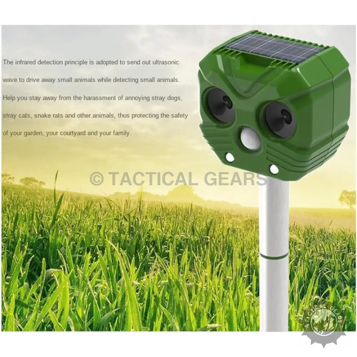 Green solar powered ultrasonic animal repeller on a pole for effective animal repellent