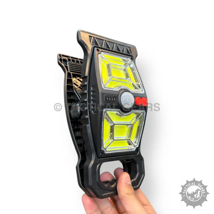 Black Solar Sensor Clip Work Light with yellow LED panels, motion sensor, and red controls