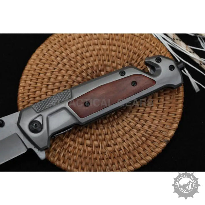 Browning DA312 Camping Hunting Knife with grey metal handle, wooden inlays, and blade
