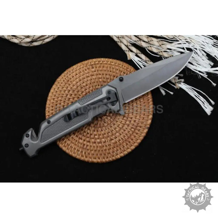 Gray tactical folding knife with sharp blade and textured handle for Browning DA312 camping and hunting use