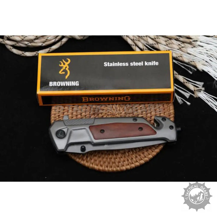 Dark gray folding knife with a reddish-brown wooden handle and a sharp blade for camping