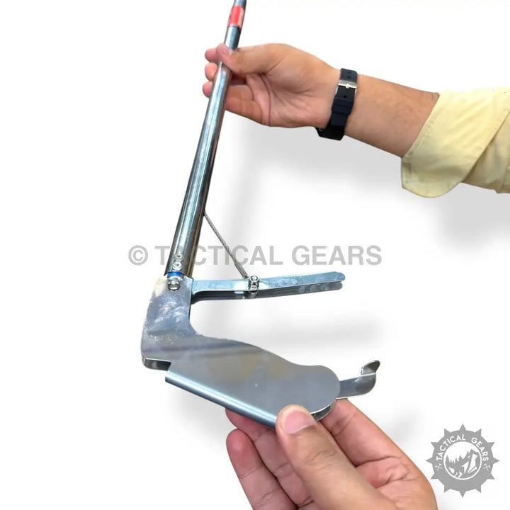 Stainless steel snake catcher with ergonomic handle and spring-loaded arm for safe catching