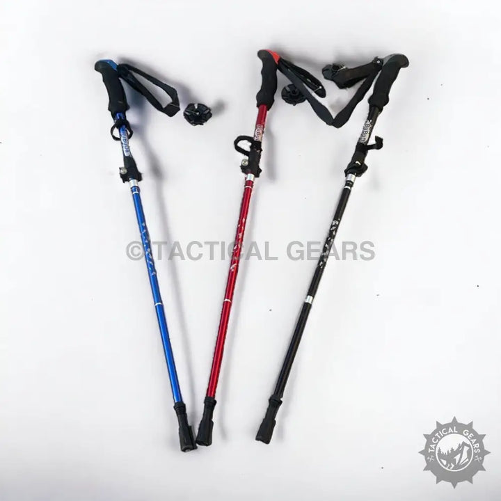 Three colorful straight handle folding trekking poles in blue red and black for outdoor hiking
