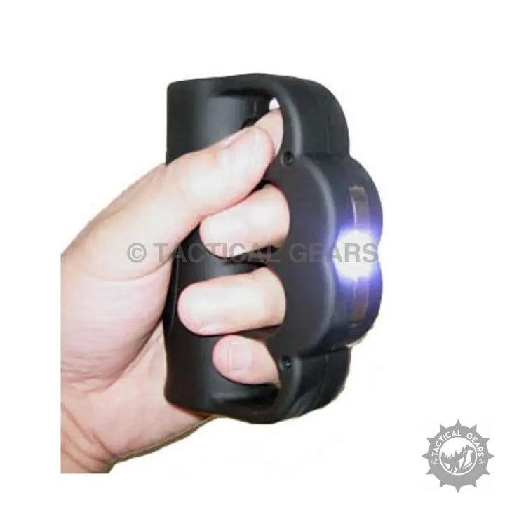 Black stun knuckle T-008 with integrated flashlight and hand grip for self-defense