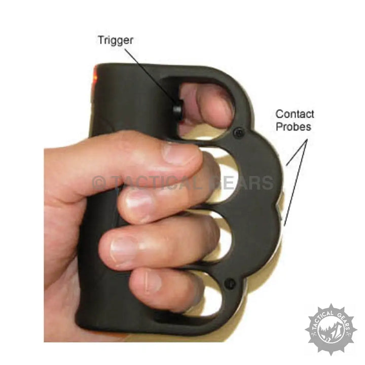 Hand holding a stun knuckle T-008 black knuckle duster stun gun for self-defense