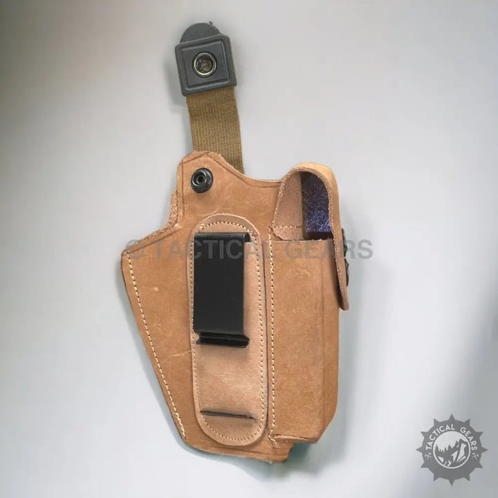 Light brown leather holster with magazine pouch and black belt clip for 9mm guns