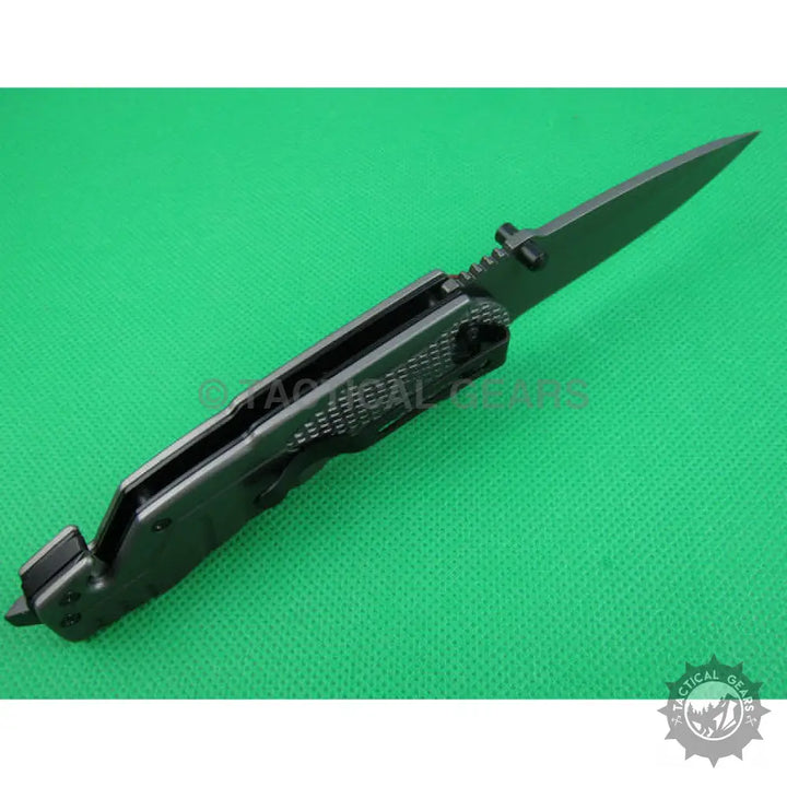 Browning X31 tactical survival knife with blade handle and partially serrated length