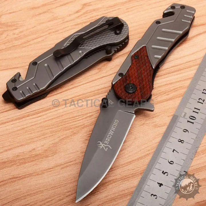 Browning X31 survival knife with wood-accented blade handle and versatile length knife