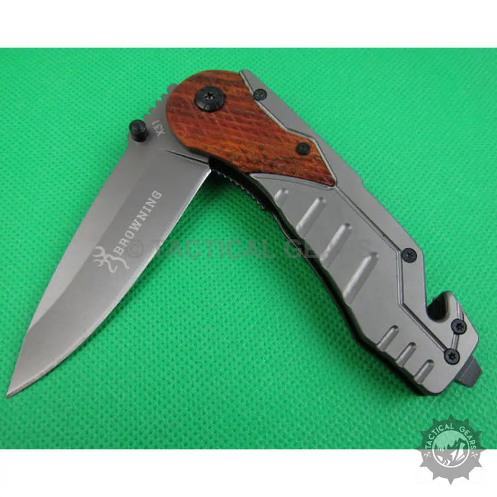 Browning X31 survival knife with gray blade and brown wood-grain handle