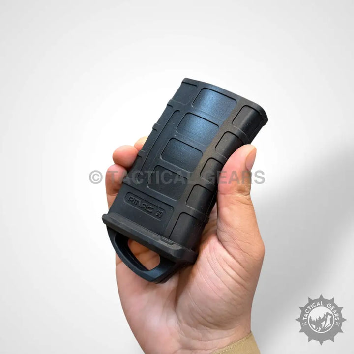Black polymer tactical assist rubber Magpul magazine with textured grip and base loop