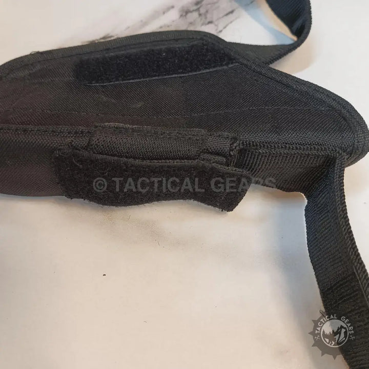 Black fabric tactical gear with hook-and-loop fasteners and pouch for Tactical Holster