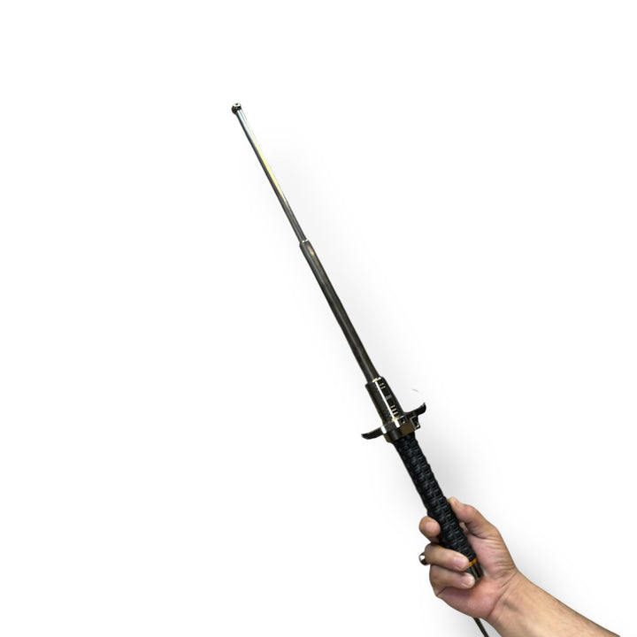 Black retractable military baton with textured grip for self-defense in Tactical Military Batons