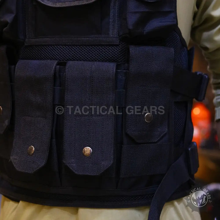 Black tactical vest with multiple pockets and mesh ventilation for armor plate protection