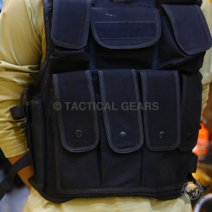 Black tactical military vest with multiple pouches and compartments for tactical military use