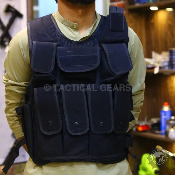 Black tactical military vest with multiple pouches for tactical military use